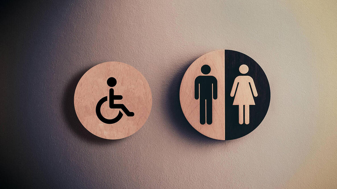 Links ein Piktogramm für Behinderung - rechts ein Piktogramm für Mann und Frau.